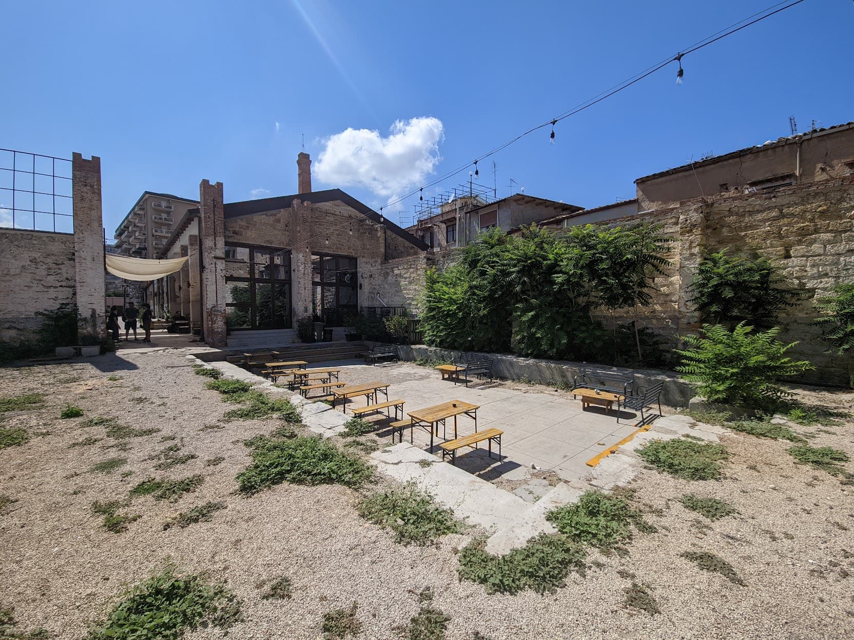 The site backs directly into Cre.Zi.Plus, a coworking space, cafe, and event venue for the campus.