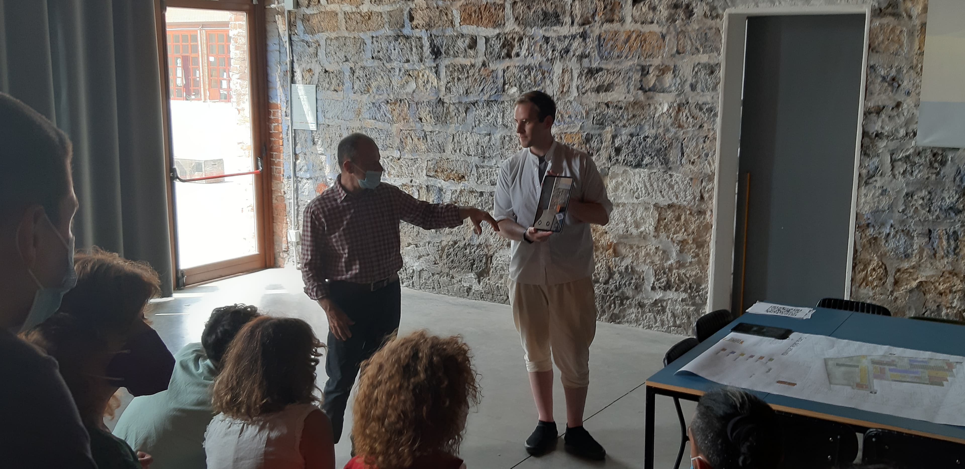 Demonstrating Wikar's AR interface to workshop participants.